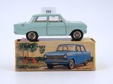 a blue toy car sitting on top of a box
