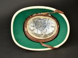 a green and white hat with a brown band