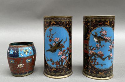three vases with birds on them sitting next to each other