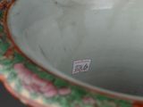 a vase with a floral design on it on a table