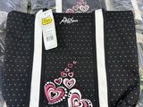 a black bag with hearts and hearts on it