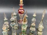 a lot of glass bottles that are sitting on a table