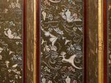 a room divider with four panels that are decorated with animals and flowers