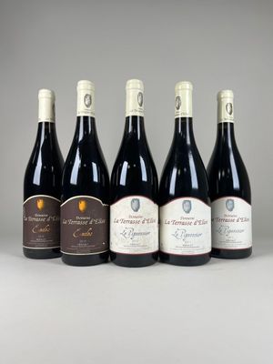 six bottles of wine lined up in a row on a table