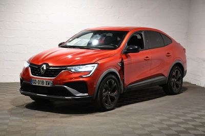 a red car parked in a garage with a checkered floor