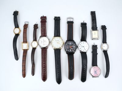 several different types of watches are lined up on a white surface