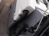 a close up view of a motor bike parked in a garage