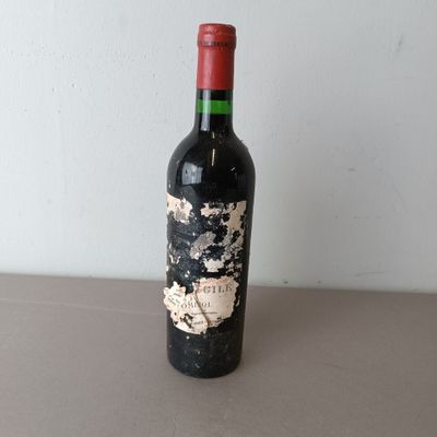 a bottle of wine that is sitting on a table