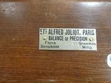 a wooden box with a label on it that says e e alfred jollett paris