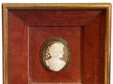 an image of a picture of a woman in profile in a wooden frame