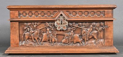 an old wooden box with carvings of people and animals on it