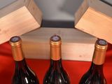 three bottles of wine sitting next to each other on a table