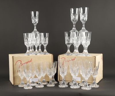 a group of six crystal wine glasses in a cardboard box