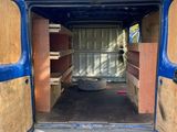 a blue van that is open with the door open