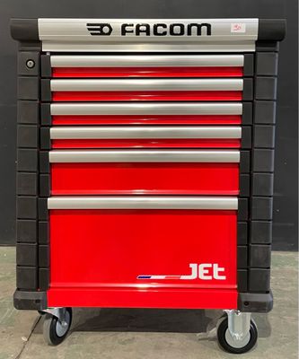 the red tool cabinet is sitting on top of the gray floor