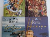 quatre livres pour enfants sont alignés sur une surface blanche