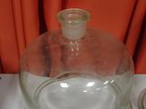 a glass bowl with a glass lid on a table