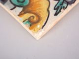 a picture of a piece of art on a table