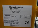 a sticker on the back of a machine that says manual stacker