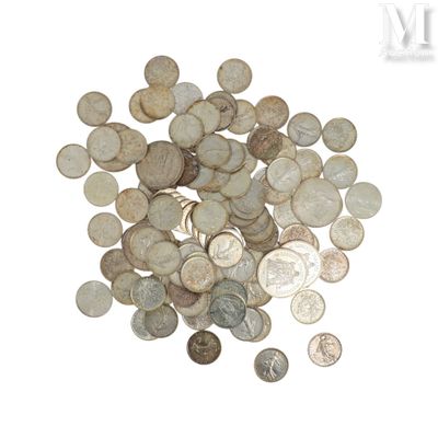 a pile of coins on a white surface
