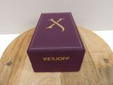purple box with gold xer - joff logo on it on a wooden table