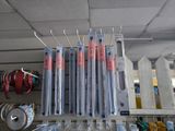 a lot of toothbrushes that are hanging on a rack