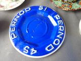 a blue plate that has a blue and white plate on it