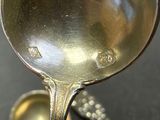 a spoon that is sitting on a table with a spoon in it