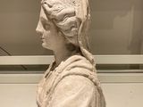 a statue of a woman that is on display in a museum