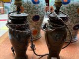 three vases that are sitting on a table