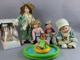 a group of dolls that are sitting next to each other