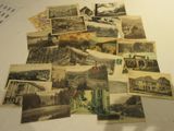 a pile of old postcards sitting on top of a table