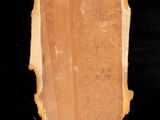 a picture of a piece of wood hanging on a wall