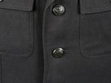 a close up of a black jacket with buttons on it
