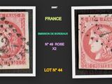 a couple of pictures of a pink stamp with a woman on it