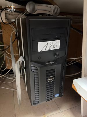 a computer tower with a keyboard and mouse on top of it