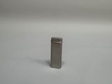 an image of a small metal object on a white surface