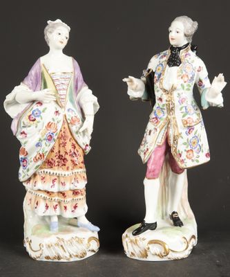 pair of porcelain figurines of a gentleman and a woman