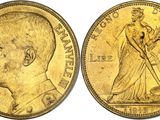 a close up of two gold coins, one of which is a man and the other is a woman
