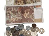 a bag full of coins and a bunch of coins