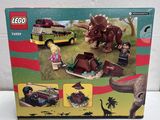 the box is open to show the contents of the lego jurassic set