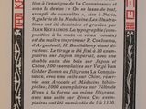 a black and white book with red writing on it