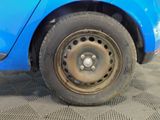 a close up of a tire on a blue car