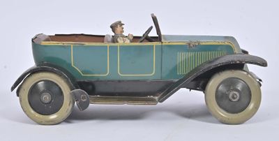 a toy car with a man sitting in the driver ' s seat