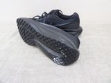they are two pairs of black sneakers on a white surface