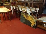 many chairs and tables in a room with pictures on them