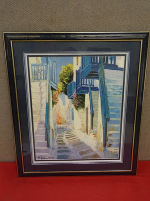 framed picture of a painting of a woman walking down a street