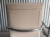 an image of a chair that is sitting in front of a wall