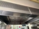 an image of a commercial kitchen with stainless steel appliances