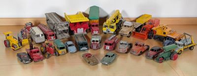 a lot of toy trucks that are sitting on the floor